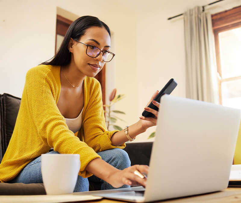 A woman using multi-factor authentication to access an online account.