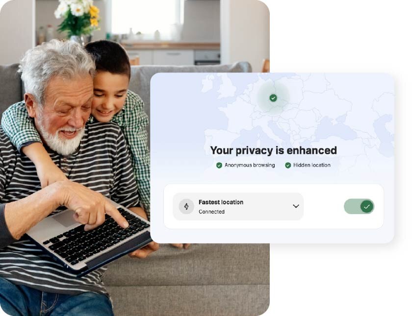 A grandfather and grandson using a laptop connect to a VPN to enhance online privacy.